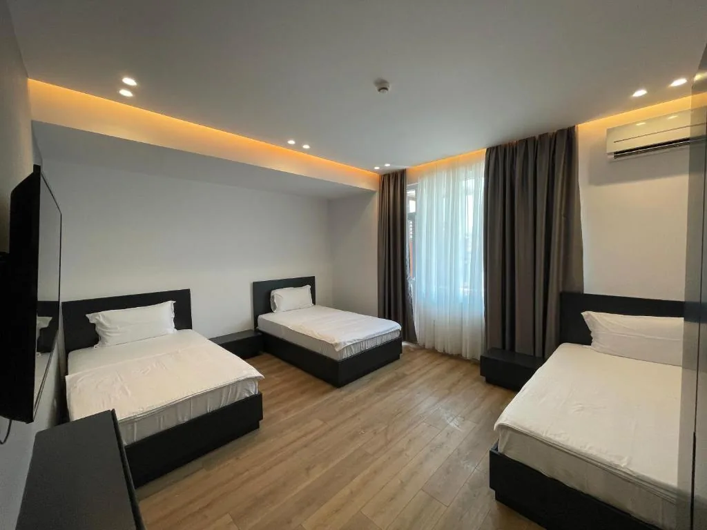 Triple Room with Balcony — Ladi Rooms